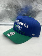 Load image into Gallery viewer, Close-up view of the Seattle Seahawks NFL '47 Throwback Blue Two Tone Hitch Snapback Adjustable Hat showcasing its adjustable snapback design and team spirit.