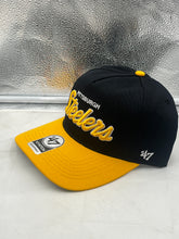 Load image into Gallery viewer, Pittsburgh Steelers NFL '47 Black Two Tone Script Hitch Snapback Adjustable Hat worn by a fan at a game, highlighting its adjustable fit and stylish appearance.