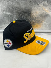 Load image into Gallery viewer, Close-up view of Pittsburgh Steelers NFL '47 Black Two Tone Script Hitch Snapback Adjustable Hat showcasing the adjustable snapback feature for a customized fit.