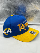Load image into Gallery viewer, Close-up of the Los Angeles Rams NFL '47 Blue Two Tone Script Hitch Snapback Adjustable Hat highlighting the sleek script logo and two-tone blue color scheme.