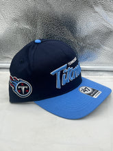 Load image into Gallery viewer, Close-up view of the Tennessee Titans NFL '47 Blue Two Tone Script Hitch Snapback Adjustable Hat, featuring the embroidered team logo.