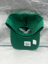 Load image into Gallery viewer, a green hat is sitting on a reflective surface