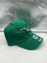 Load image into Gallery viewer, a green hat sitting on top of a white counter