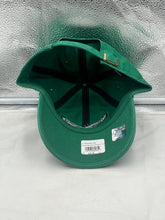 Load image into Gallery viewer, a green hat sitting on top of a white counter