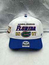 Load image into Gallery viewer, Florida Gators NCAA '47 Brand Champs White Hitch Adjustable Snapback Hat displayed on a wooden table.