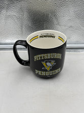 Load image into Gallery viewer, Pittsburgh Penguins NHL Black 15oz Coffee Mug showcasing the iconic team logo, perfect for coffee lovers and hockey fans.
