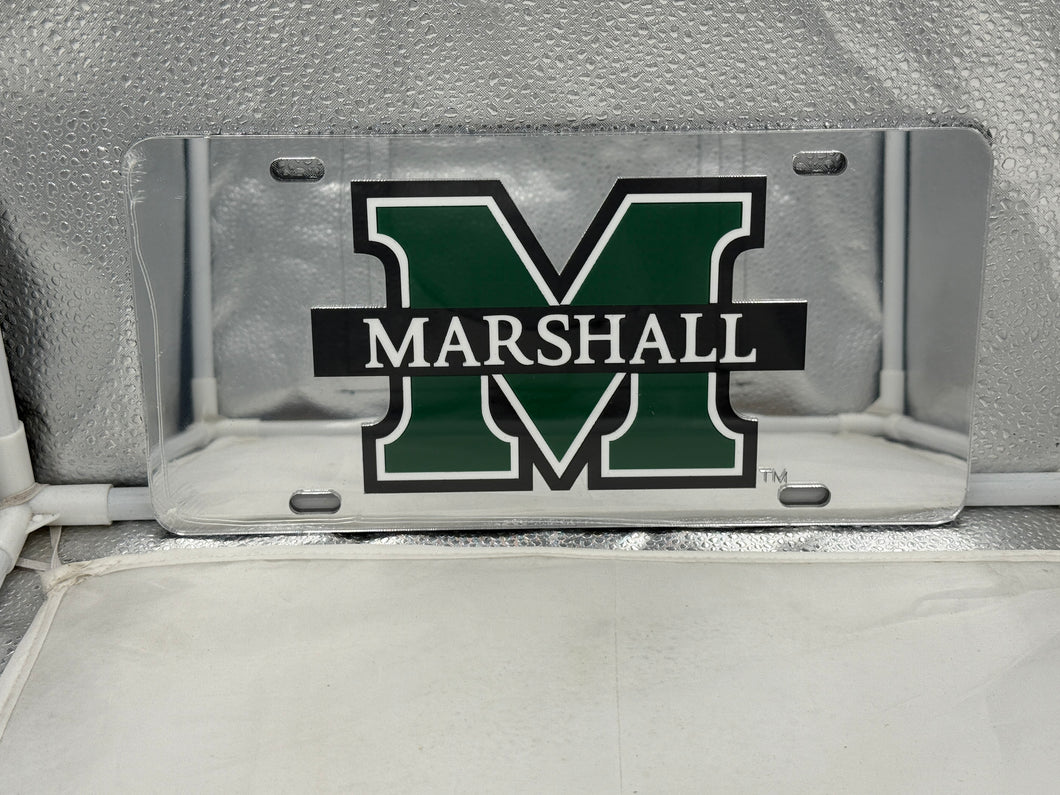 Marshall Thundering Herd NCAA Silver Mirrored Laser Cut License Plate Craftique, showcasing a stunning silver mirrored finish and intricate laser-cut logo, perfect for any fan's vehicle or home décor.