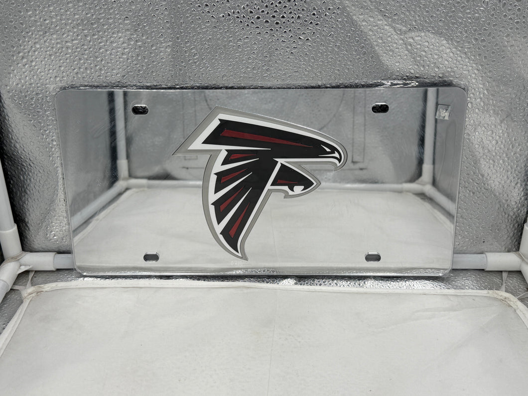 Atlanta Falcons NFL Silver Reflective Lasercut License Plate by WinCraft showcasing intricate team logo and durable construction, designed to display pride for Atlanta Falcons fans on vehicles.