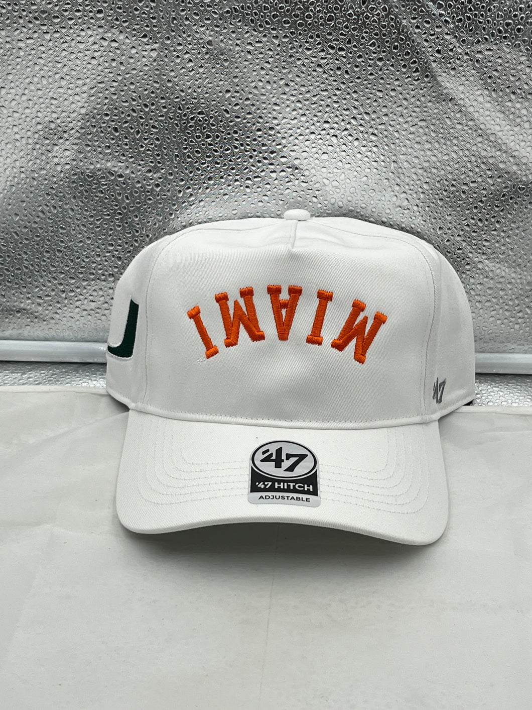 Miami Hurricanes NCAA '47 White Reversed Hitch Script Adjustable Snapback Hat showcasing the logo and unique design suitable for game days.