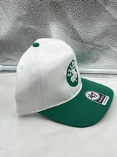 Load image into Gallery viewer, Close-up view of the Boston Celtics NBA &#39;47 Brand White Two Tone Hitch Adjustable Snapback Hat, highlighting the quality stitching and adjustable snapback feature.
