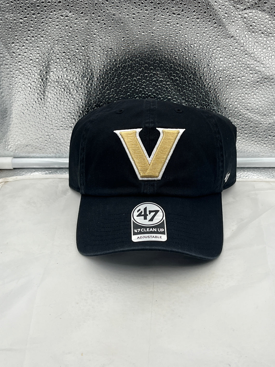 Vanderbilt Commodores NCAA '47 Brand Black Clean Up Adjustable Strapback Hat showcasing the iconic Vanderbilt logo, perfect for fans looking for a stylish and comfortable accessory.
