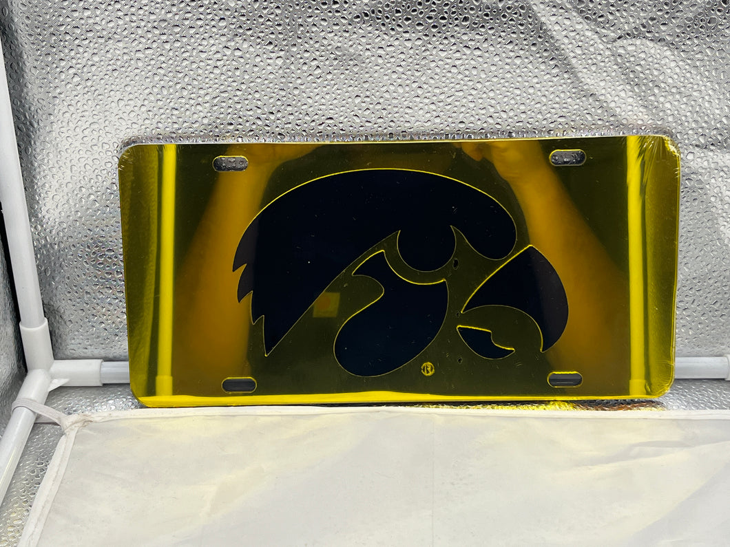 Iowa Hawkeyes NCAA Yellow Mirrored Laser Cut License Plate by Craftique, showcasing vibrant yellow design and mirrored finish, perfect for displaying team pride on your vehicle.