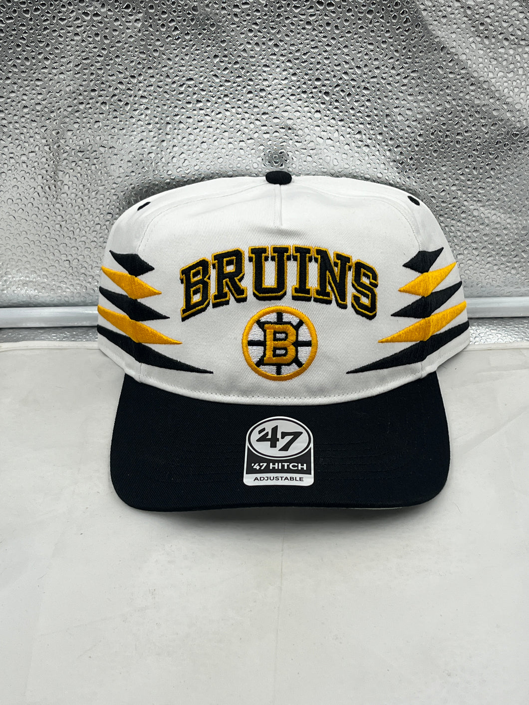 Boston Bruins NHL '47 Brand White Diamond Hitch Adjustable Snapback Hat showcasing stylish design and team colors
