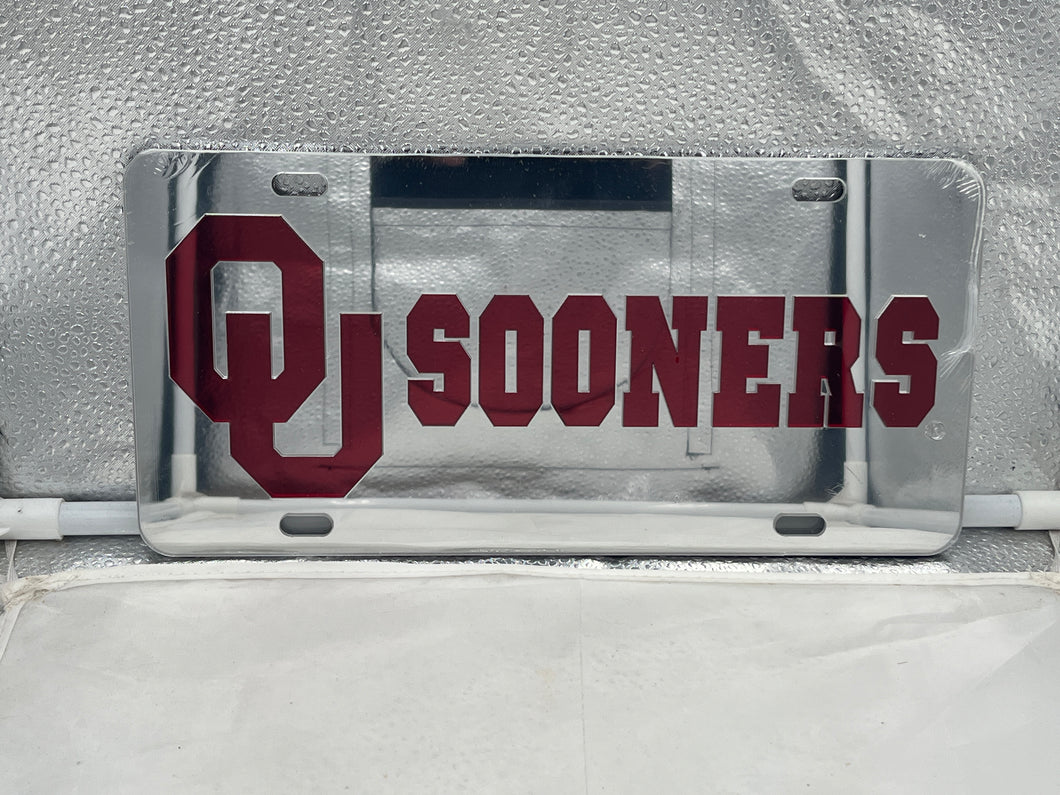 Oklahoma Sooners NCAA Silver Mirrored Laser Cut License Plate by Craftique showcasing intricate design and team logo.