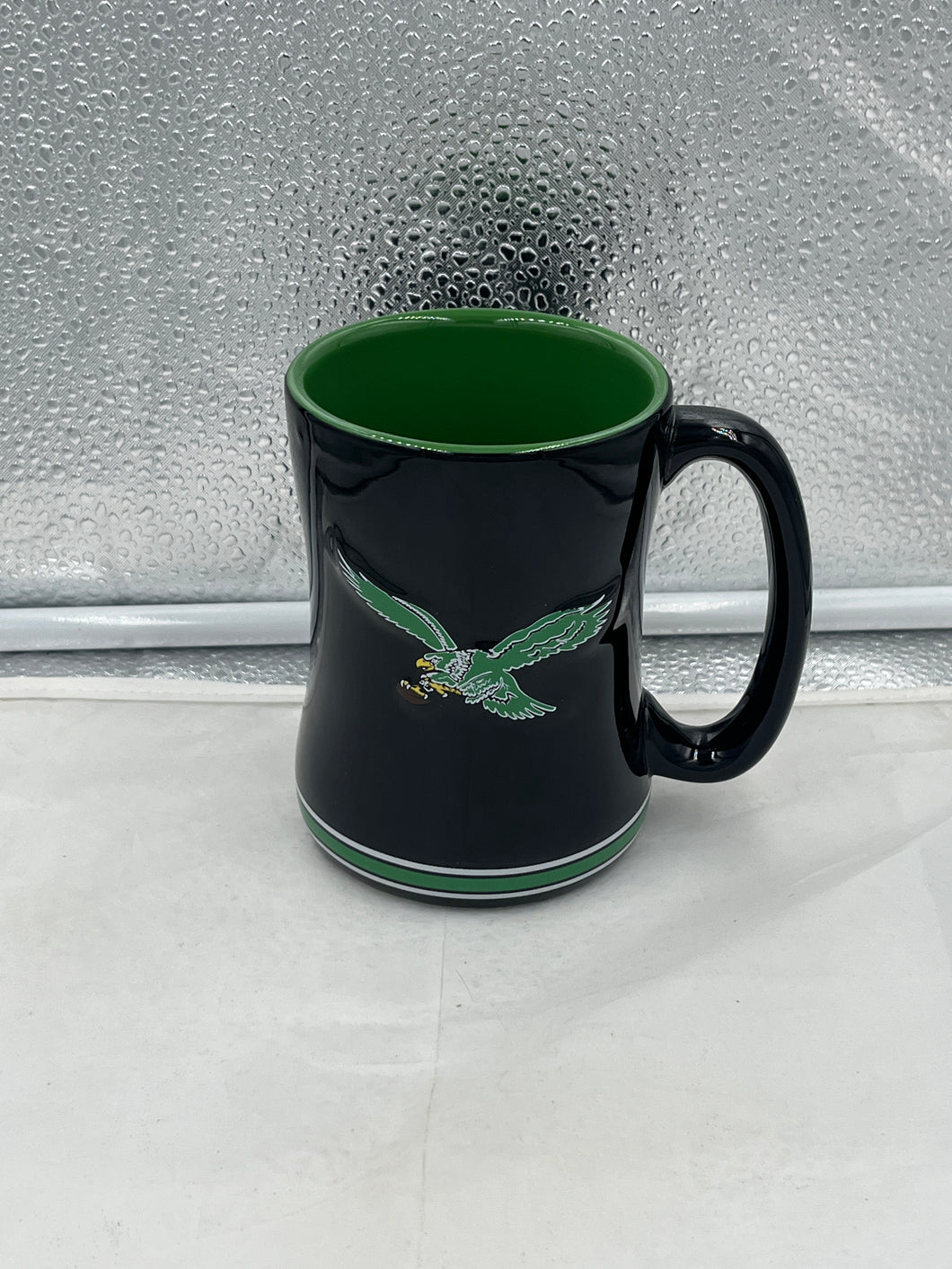 Philadelphia Eagles Throwback NFL 14oz Coffee Mug featuring the vintage Eagles logo, perfect for enthusiastic fans to enjoy their favorite beverage.
