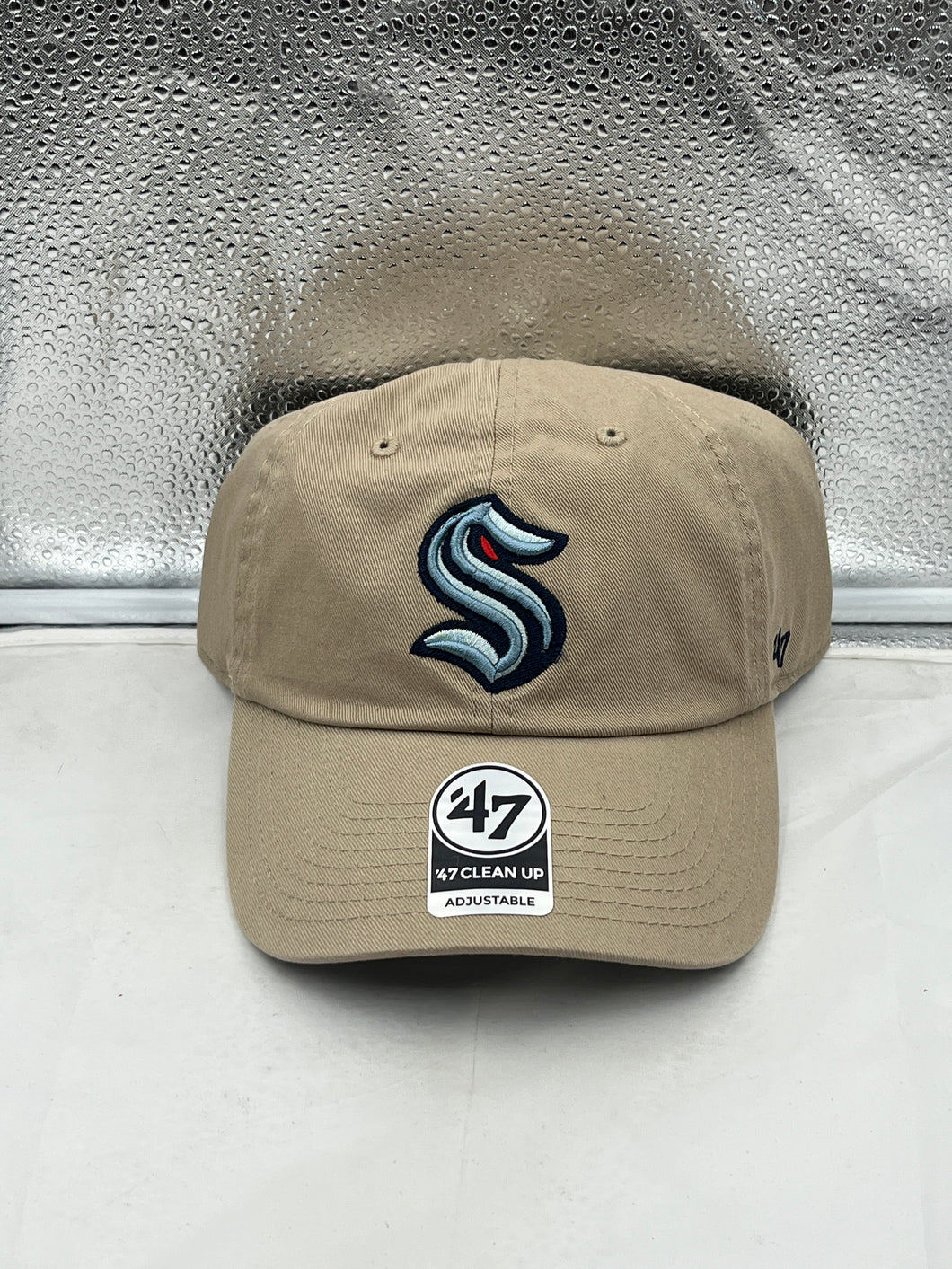 Seattle Kraken NHL '47 Brand Khaki Clean Up Adjustable Hat showcasing the embroidered team logo on the front.