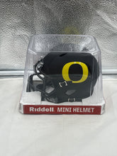 Load image into Gallery viewer, Close-up view of the Oregon Ducks NCAA Riddell Speed Black Mini Helmet displaying intricate detailing, ideal for sports memorabilia collection.
