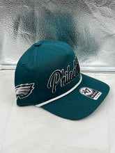 Load image into Gallery viewer, Philadelphia Eagles NFL &#39;47 Brand Green Script Hitch Snapback Adjustable Hat displayed on a surface showing its stylish design and color.

