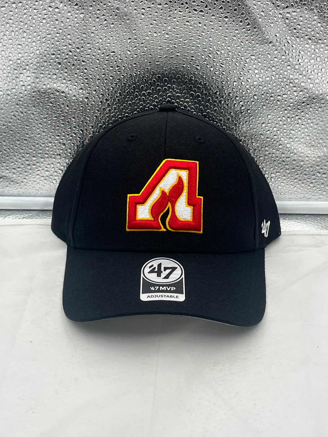Front view of the Atlanta Flames NHL '47 Brand Throwback Black MVP Adjustable Hat showcasing the classic logo and stylish design.