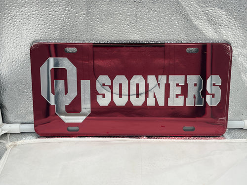 Oklahoma Sooners NCAA Red Mirrored Laser Cut License Plate Craftique showcasing the vibrant red mirrored finish and official team logo, perfect for displaying team spirit on your vehicle.