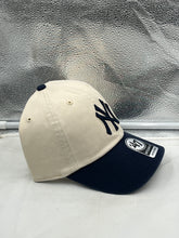 Load image into Gallery viewer, New York Yankees MLB &#39;47 Brand Natural Two Tone Clean Up Adjustable Hat displayed against a neutral background, showcasing its classic design and iconic Yankees logo.
