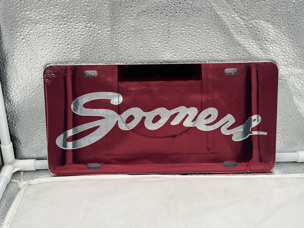 Oklahoma Sooners NCAA Red Mirrored Laser Cut License Plate by Craftique showcasing vibrant red color and elegant mirrored finish, perfect for displaying team spirit on vehicles.