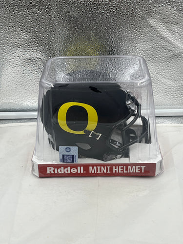 Oregon Ducks NCAA Riddell Speed Black Mini Helmet showcasing sleek design and vibrant team colors, perfect collectible for fans.