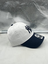 Load image into Gallery viewer, Back view of New York Yankees MLB &#39;47 Brand Natural White Two Tone Clean Up Adjustable Hat exhibiting the adjustable strap for a comfortable fit.
