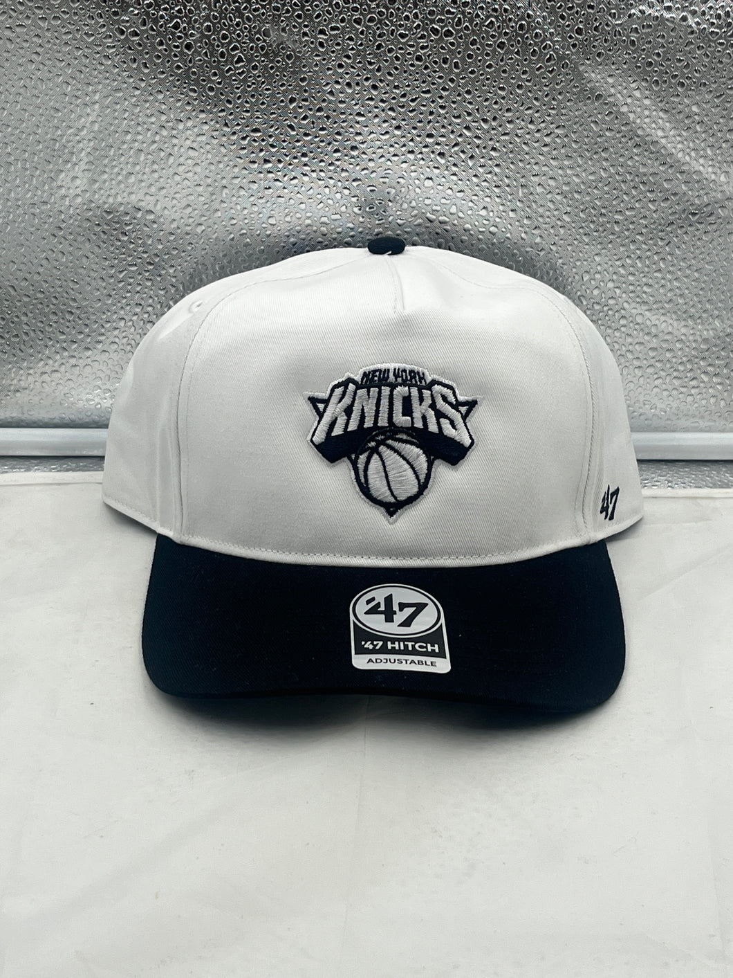 New York Knicks NBA '47 Brand White Two Tone Hitch Adjustable Snapback Hat showcasing a classic design with adjustable snapback closure for a perfect fit.