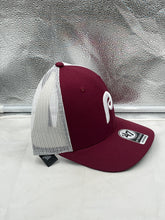 Load image into Gallery viewer, Lifestyle shot of the Philadelphia Phillies MLB &#39;47 Throwback Red Trucker Snapback Adjustable Hat worn by a fan at a baseball game, emphasizing team spirit.
