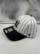 Load image into Gallery viewer, Close-up of the New York Yankees MLB &#39;47 Brand White Pinstripe Two Tone MVP Adjustable Hat showcasing the logo and adjustable strap, ideal for New York Yankees hat enthusiasts.

