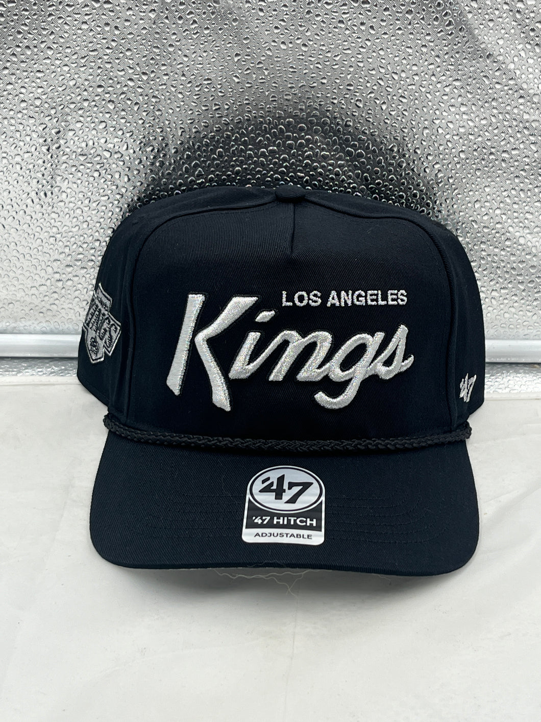 Los Angeles Kings NHL '47 Brand Black Script Hitch Rope Adjustable Snapback Hat displayed front view showcasing the stylish black script logo.