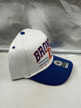 Load image into Gallery viewer, Lifestyle shot of the Denver Broncos NFL '47 Throwback White TT Hitch Rope Snapback Adjustable Hat worn outdoors by a fan, demonstrating its stylish look and versatility as a Denver Broncos hat.
