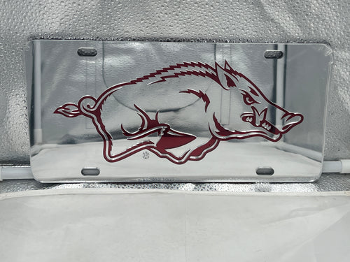 Arkansas Razorbacks NCAA Silver Mirrored Laser Cut License Plate by Craftique showcasing a sleek design that displays team spirit.