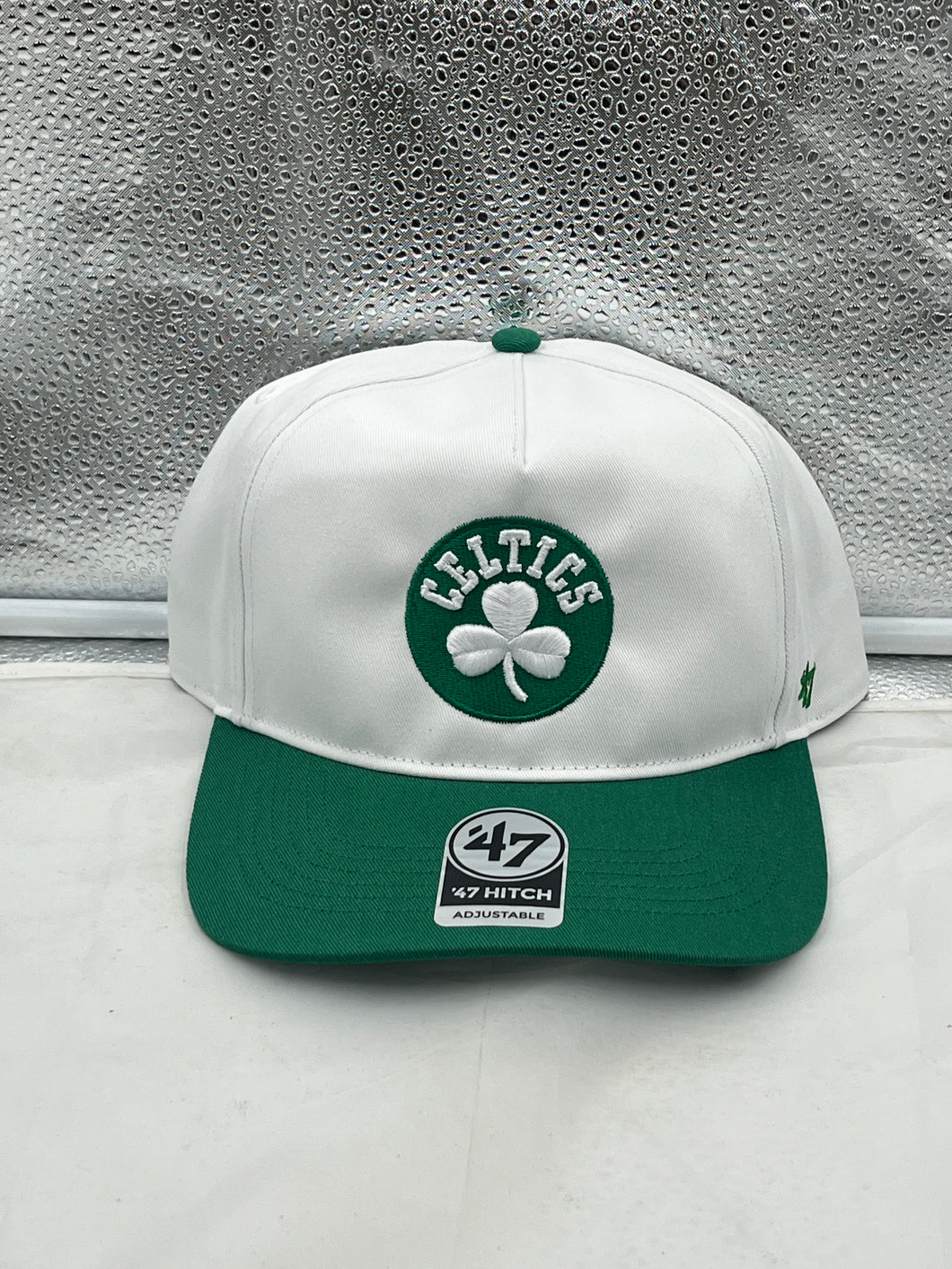 Boston Celtics NBA '47 Brand White Two Tone Hitch Adjustable Snapback Hat, a stylish and comfortable accessory for fans, featuring adjustable fit and vibrant team colors.