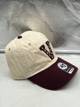 Load image into Gallery viewer, Vancouver Canucks NHL &#39;47 Brand Throwback Clean Up Tan Two Tone Adjustable Hat worn by a fan at a game, highlighting its comfortable fit and vintage throwback style.

