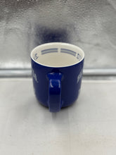 Load image into Gallery viewer, Duke Blue Devils Mug displayed in a cozy kitchen setting, ideal for enjoying hot coffee or iced tea.
