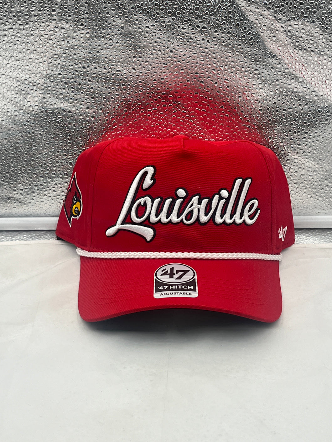 Louisville Cardinals NCAA '47 Brand Red Script Hitch Adjustable Snapback Hat showcasing bold red color and iconic white script logo, perfect for fans and casual wear.