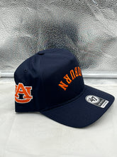 Load image into Gallery viewer, Close-up of the Auburn Tigers NCAA &#39;47 Brand Navy Reversed Hitch Script Adjustable Snapback Hat showing fabric texture.
