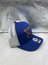 Load image into Gallery viewer, The St Louis Blues NHL &#39;47 Brand Throwback Blue Trucker Adjustable Snapback Hat displayed outdoors, emphasizing its breathable mesh back.
