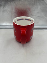 Load image into Gallery viewer, Lifestyle shot of the Philadelphia Phillies Mug in use, highlighting its generous 15oz capacity and comfortable grip, perfect for game days or morning coffee.

