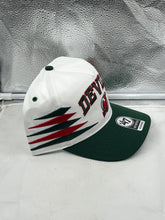 Load image into Gallery viewer, Close-up of the front logo on the New Jersey Devils NHL &#39;47 Brand White Diamond Hitch Adjustable Snapback Hat highlighting the team&#39;s iconic emblem.
