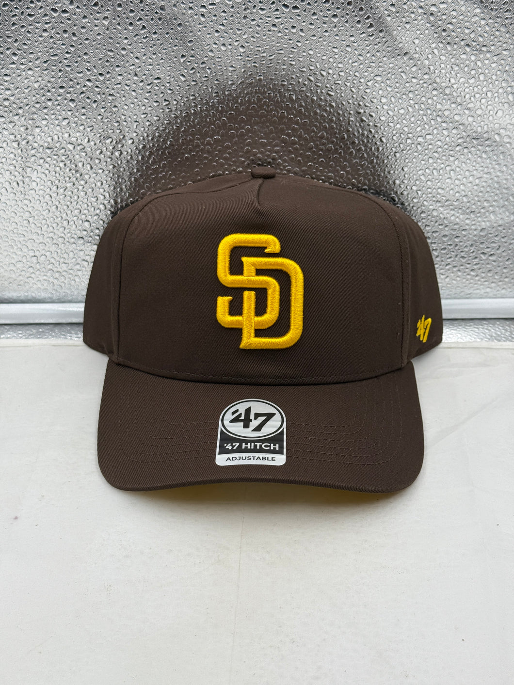 San Diego Padres MLB '47 Brand Brown Hitch Adjustable Snapback Hat featured front view, showcasing a vintage look ideal for fans, perfect for all baseball enthusiasts looking for a stylish San Diego Padres hat.