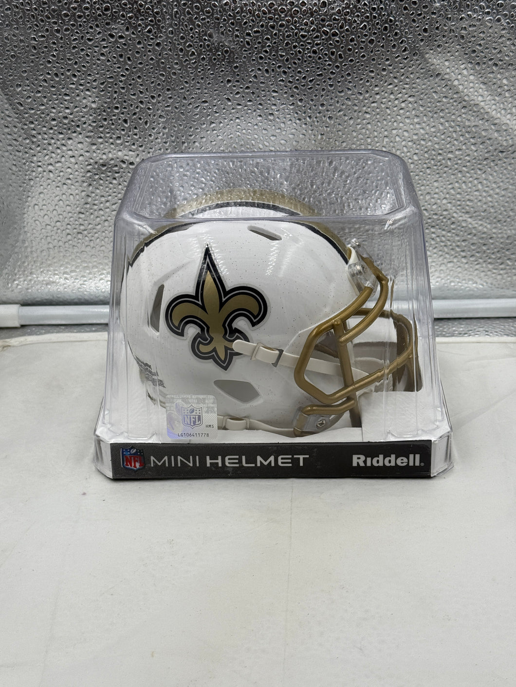 New Orleans Saints NFL Riddell Speed On-Field Alternate White Mini Helmet, showcasing a detailed design and team logo, ideal for collectors and fans of the New Orleans Saints Mini Helmet.