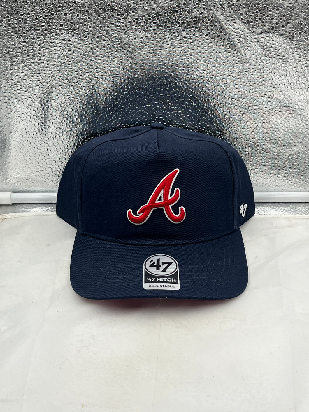 Atlanta Braves MLB '47 Brand Navy Blue Hitch Adjustable Snapback Hat for loyal fans, showcasing durability and style perfect for game day.