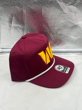 Load image into Gallery viewer, Person wearing the Washington Commanders hat indoors, demonstrating its stylish design suitable for every fan.
