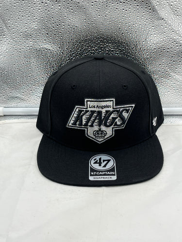 Los Angeles Kings NHL '47 Brand Black Adjustable Captain Snapback Hat featuring a sleek black design and the iconic team logo, perfect for showcasing your team spirit.