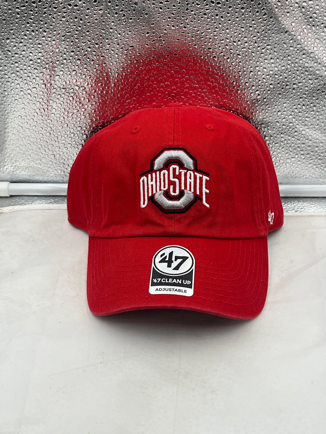 Ohio State Buckeyes NCAA '47 Brand Red Clean Up Adjustable Hat displayed on a white background, showcasing its vibrant red color and iconic Buckeyes logo.