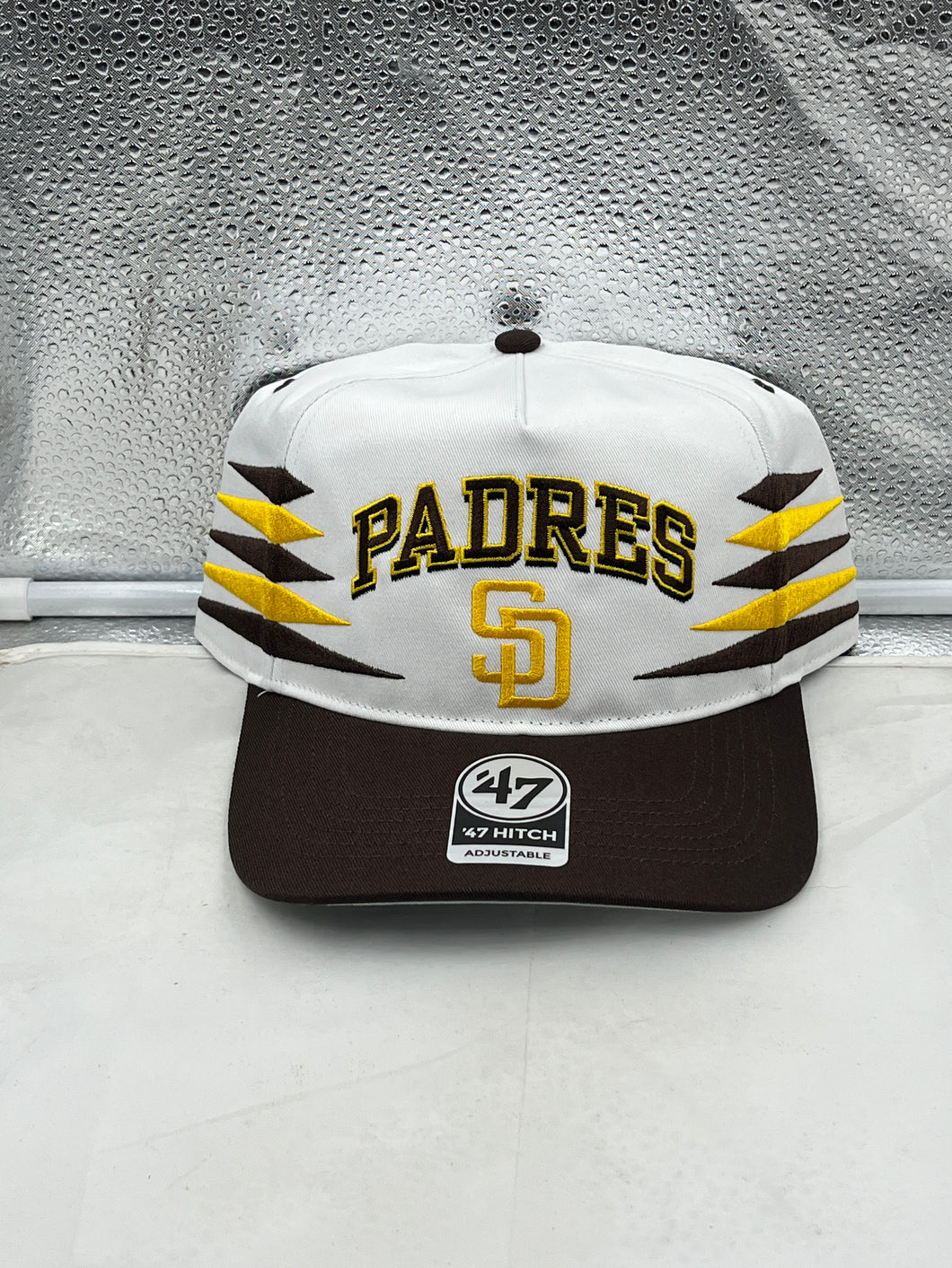 San Diego Padres MLB '47 Brand White Diamond Hitch Adjustable Snapback Hat showcasing its sleek design and adjustable features.