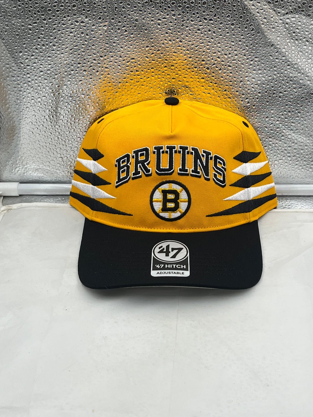 Boston Bruins NHL '47 Brand Yellow Diamond Hitch Adjustable Snapback Hat showcasing a stylish yellow design with a diamond pattern, perfect for fans and casual wear.